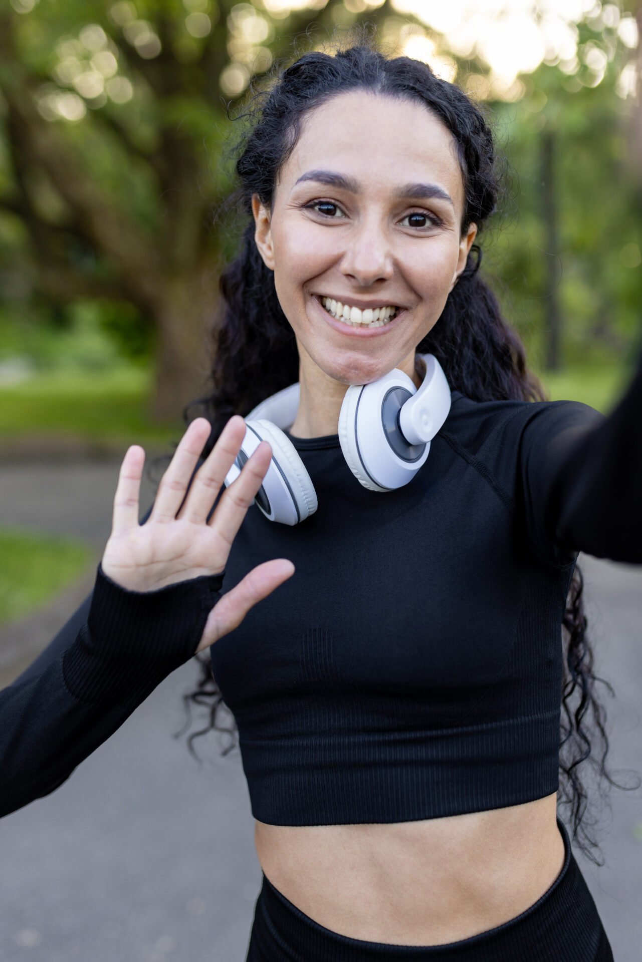 Active young woman enjoying music outdoors with headphones